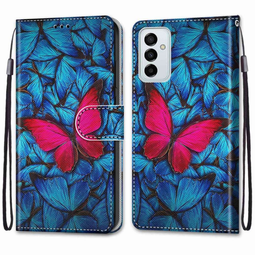 Folio-hoesje voor Samsung Galaxy M23 5G Rode Vlinder Op Blauwe Achtergrond