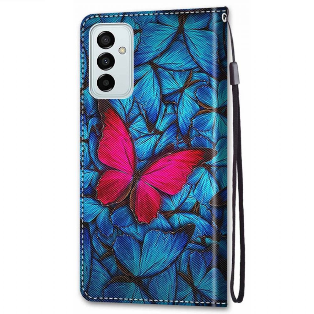 Folio-hoesje voor Samsung Galaxy M23 5G Rode Vlinder Op Blauwe Achtergrond